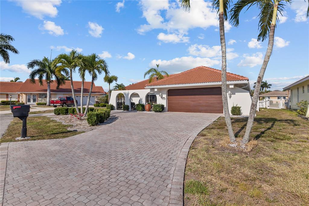 a house with palm tree in front of it