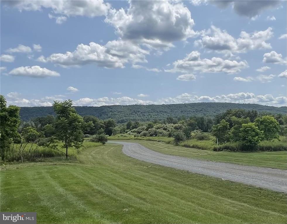 a view of a lake with a big yard