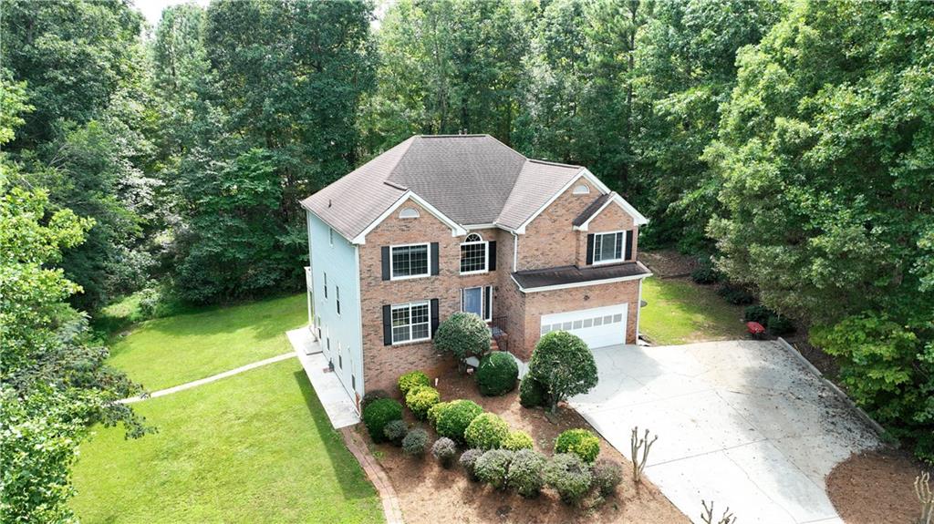 a aerial view of a house with a yard