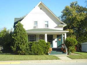 a view of house with yard