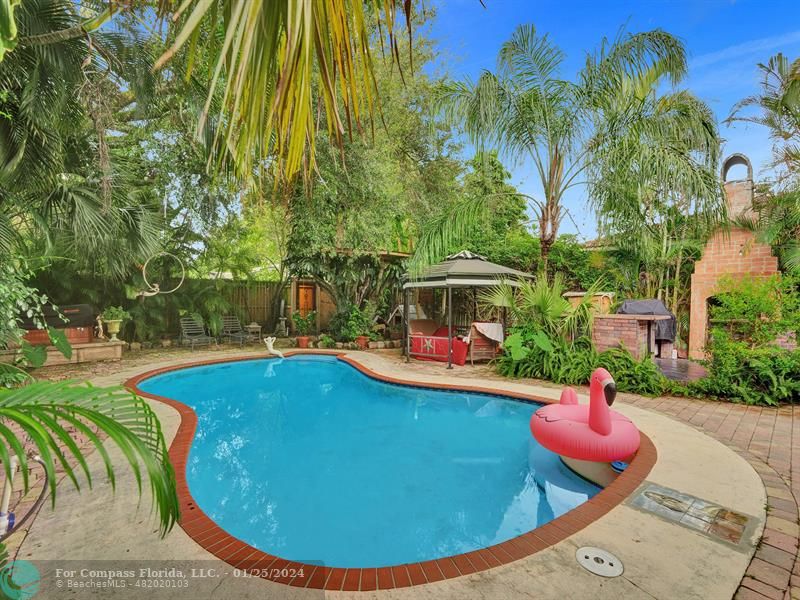 a view of a swimming pool with a patio