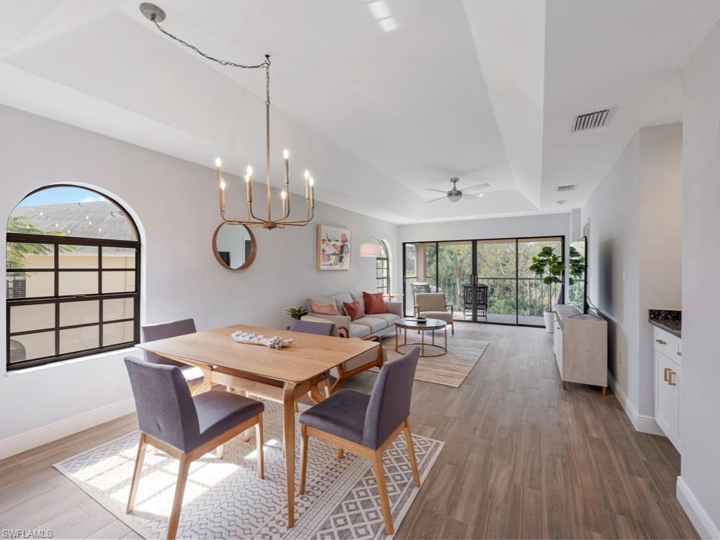 a view of a dining room with furniture window and outside view