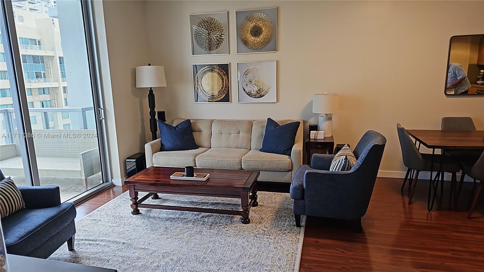 a living room with furniture and a rug