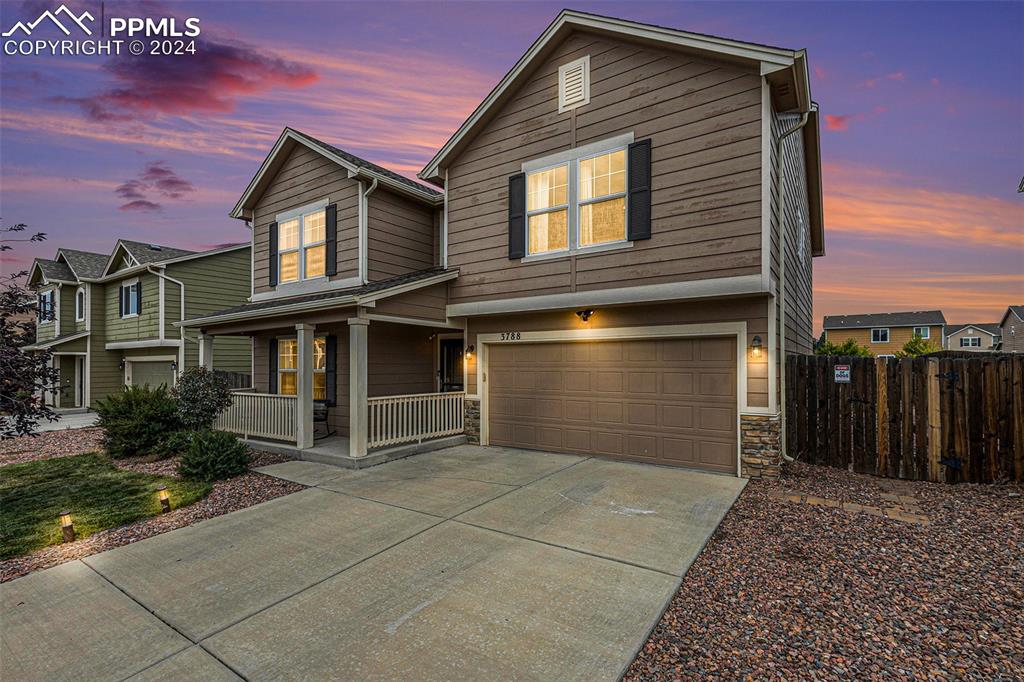 a front view of a house with a garage