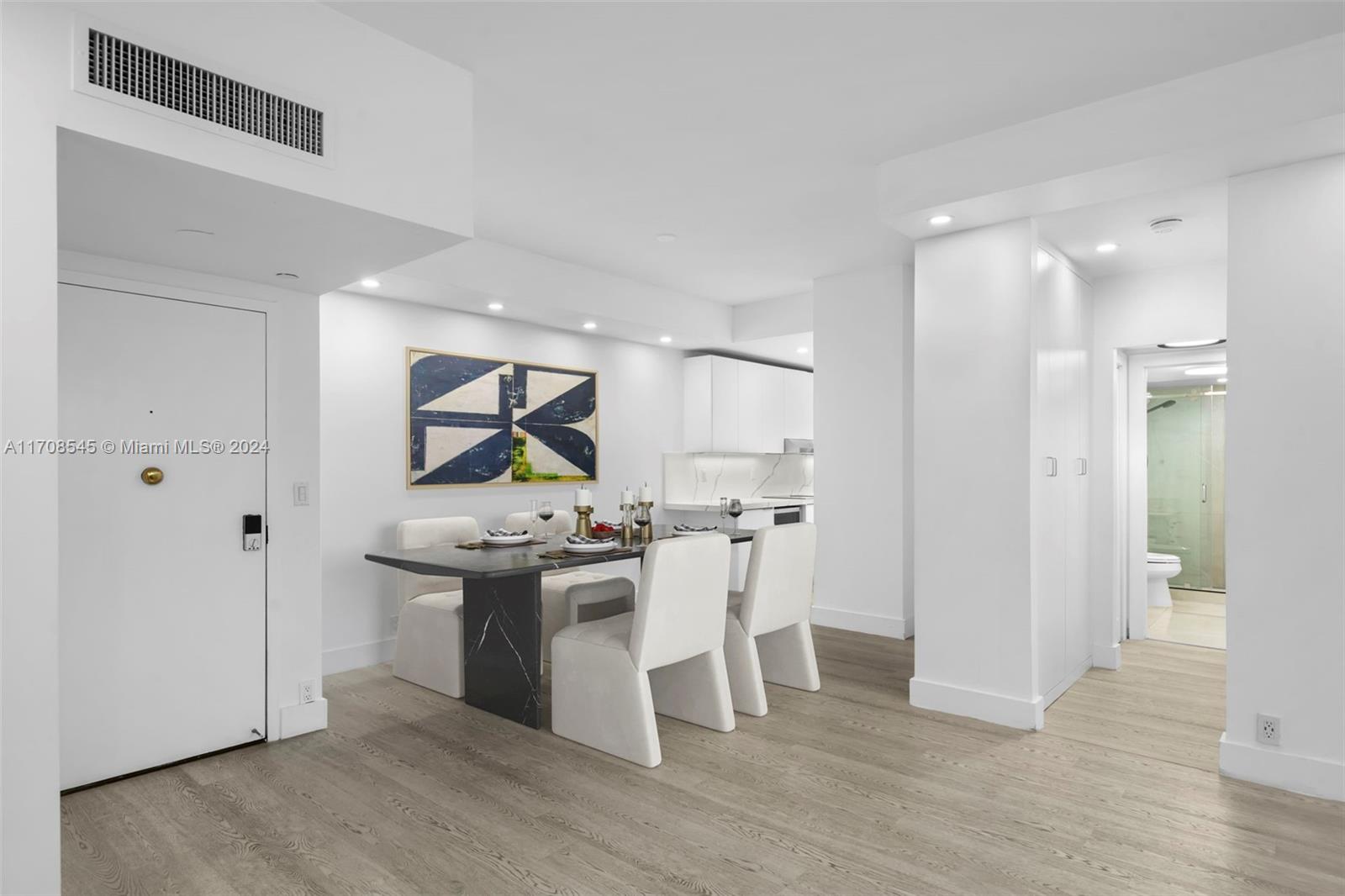 a view of a kitchen and dining room