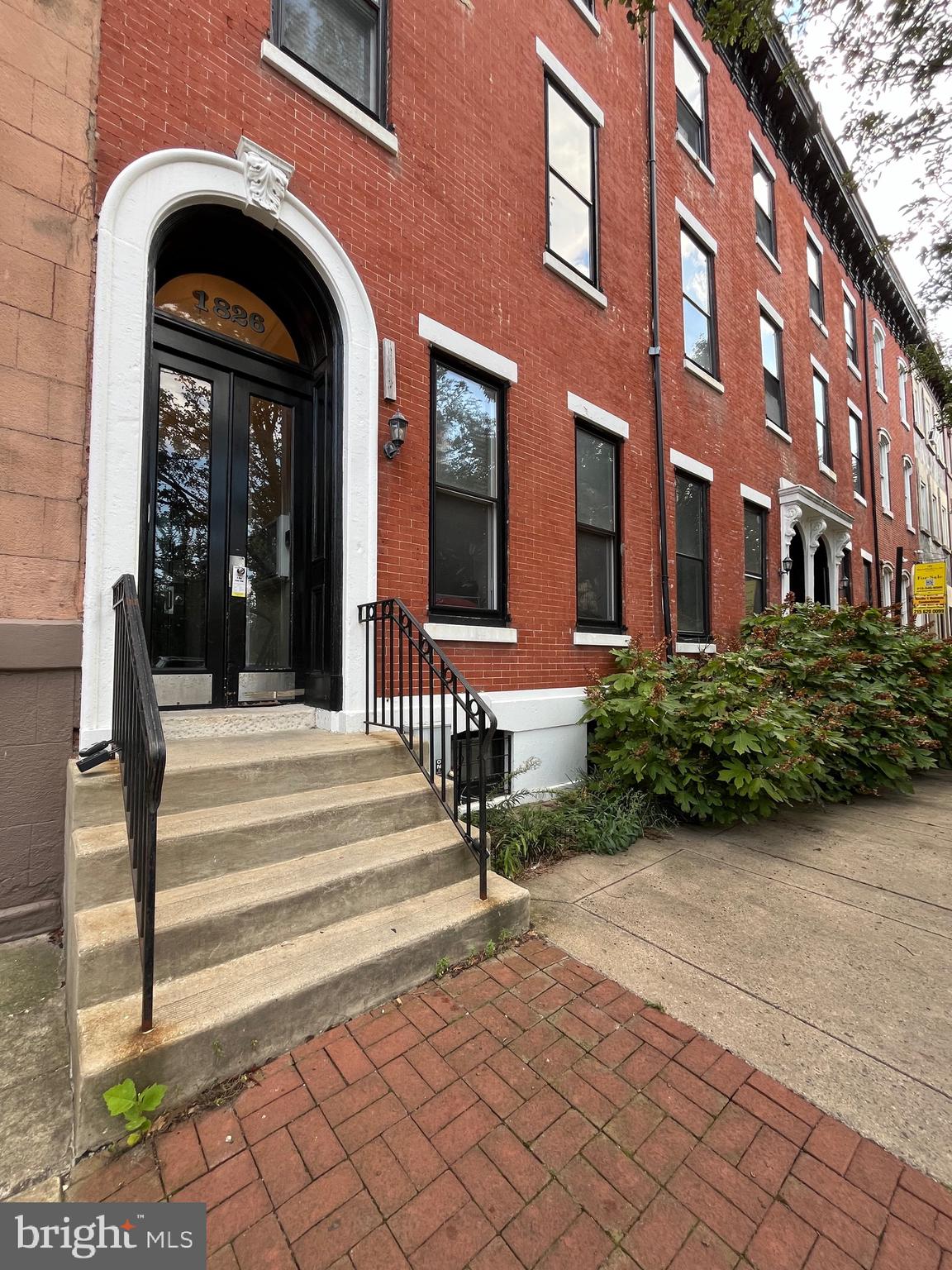 a view of a building with entryway doors