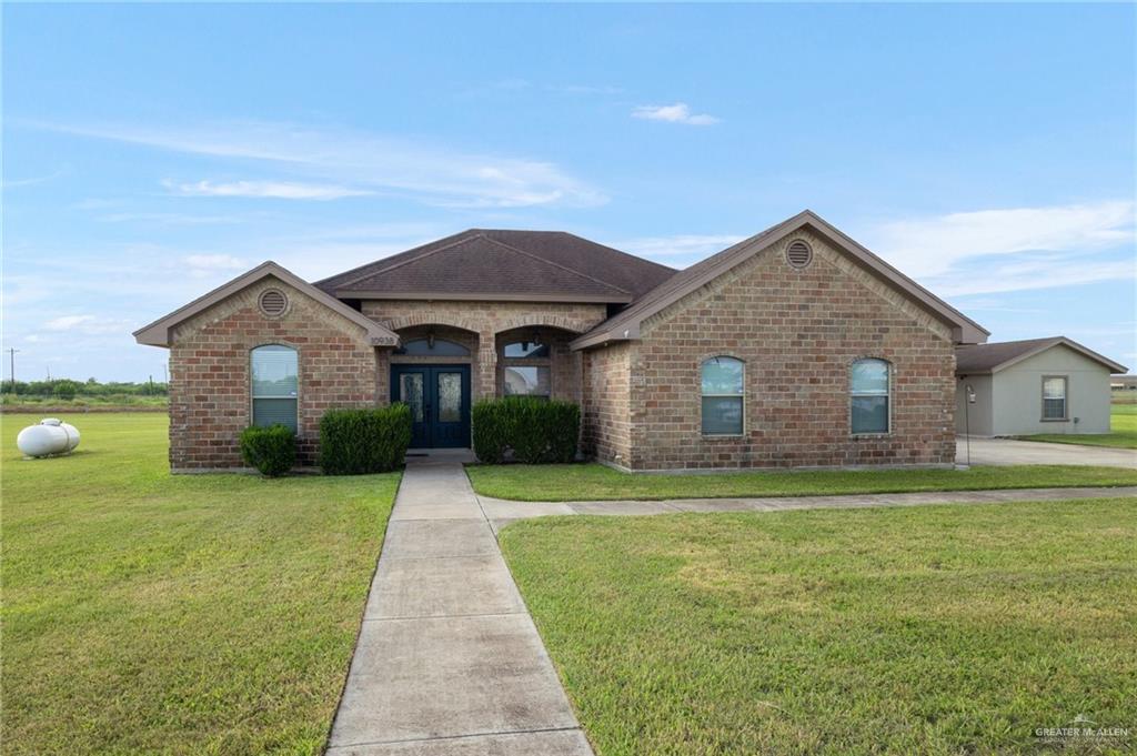 a front view of a house with yard