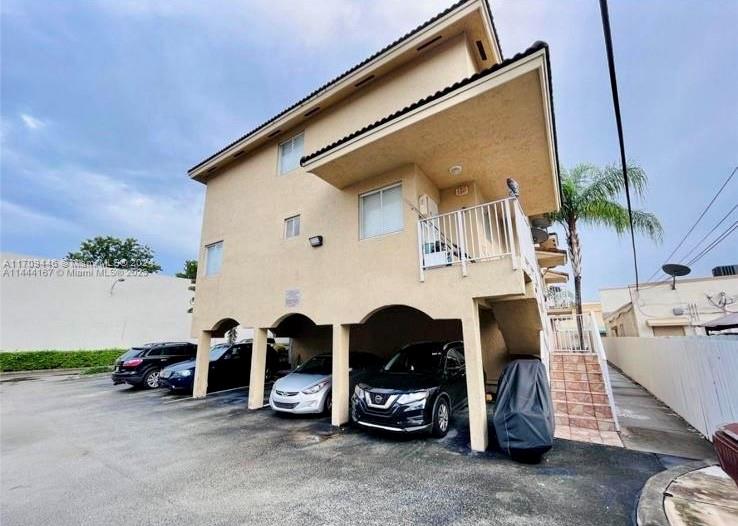 a view of a car park in front of house