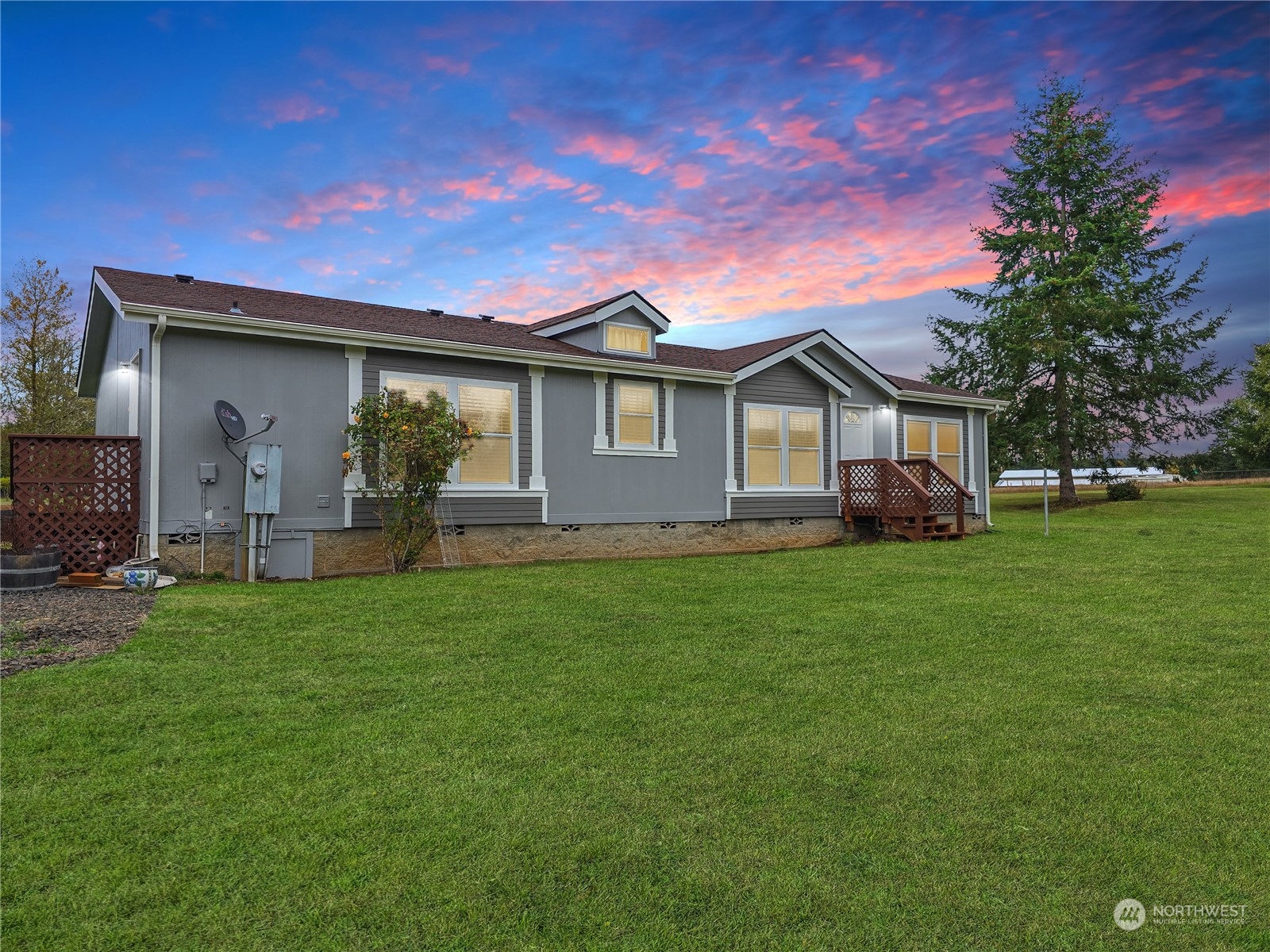 a front view of house with yard and green space