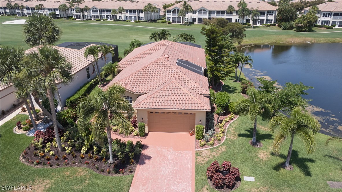 an aerial view of a house with a lake view