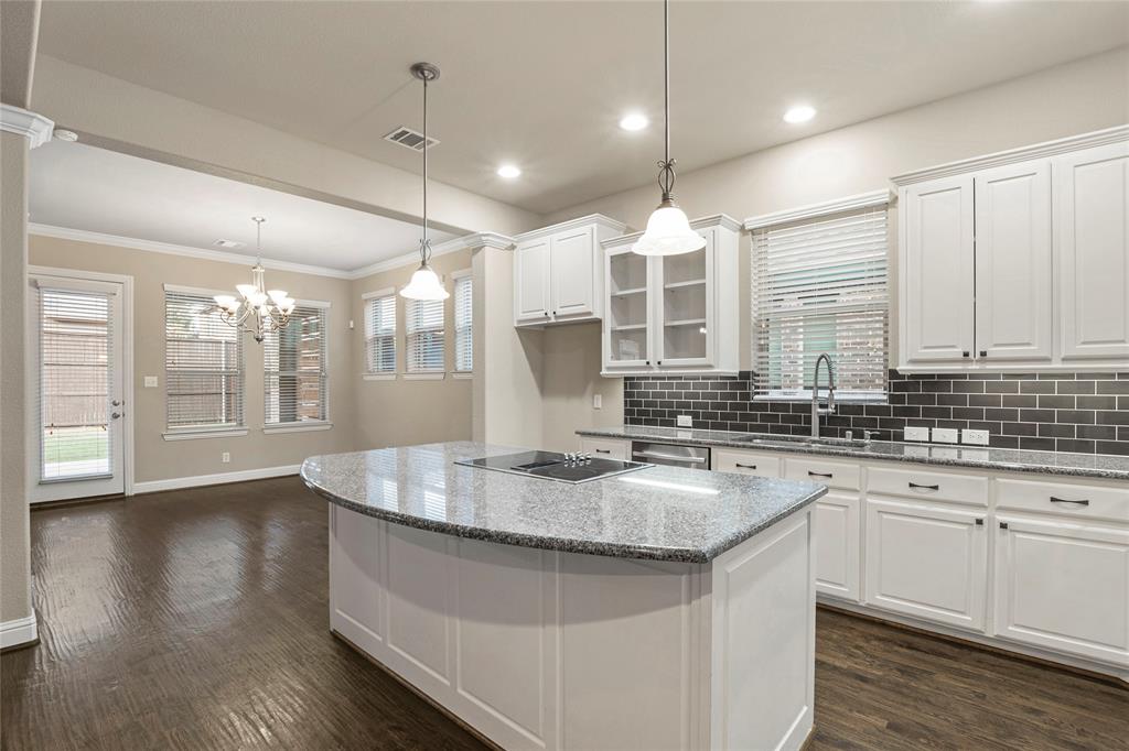 a kitchen with lots of counter space a sink and appliances