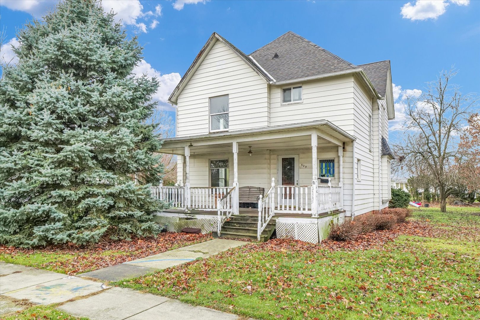 a view of a house with a yard