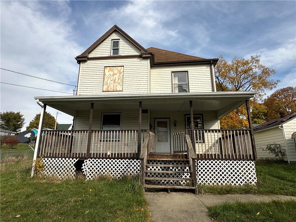 a front view of a house with garage