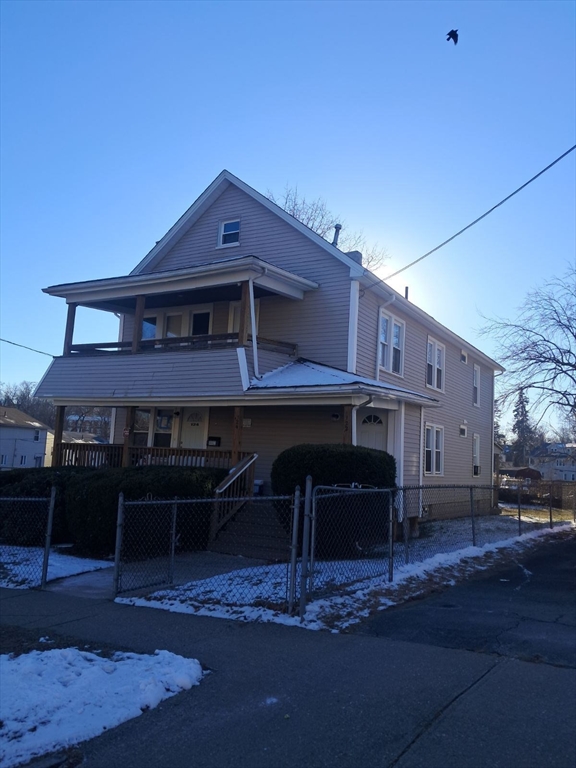 a view of a house with wooden deck