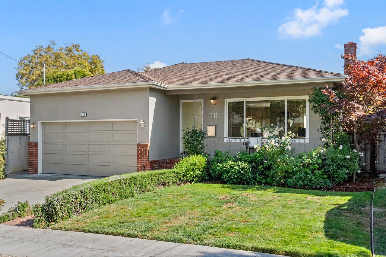 a front view of a house with garden