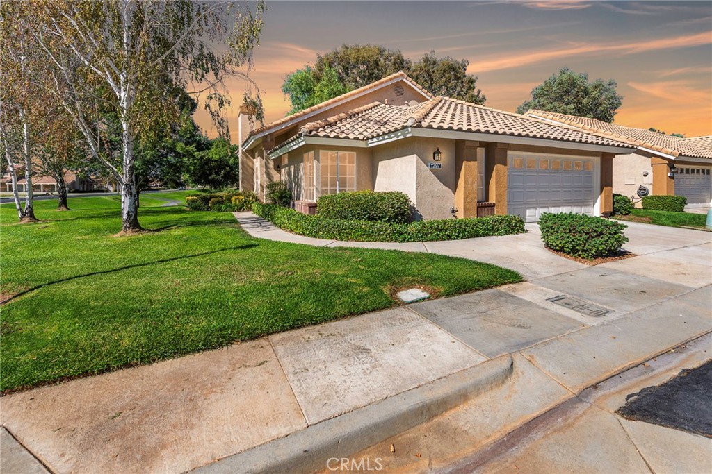 front view of a house and a yard