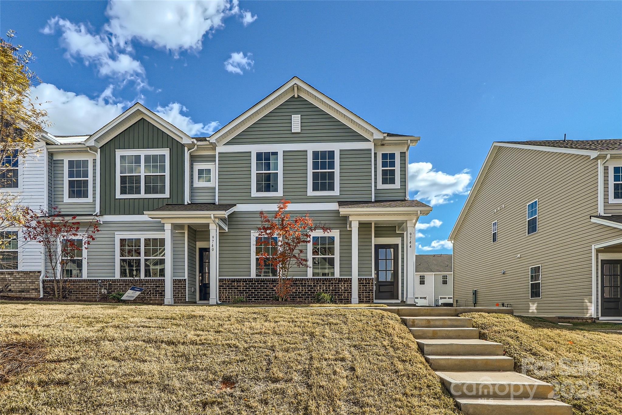 a front view of a house with a yard