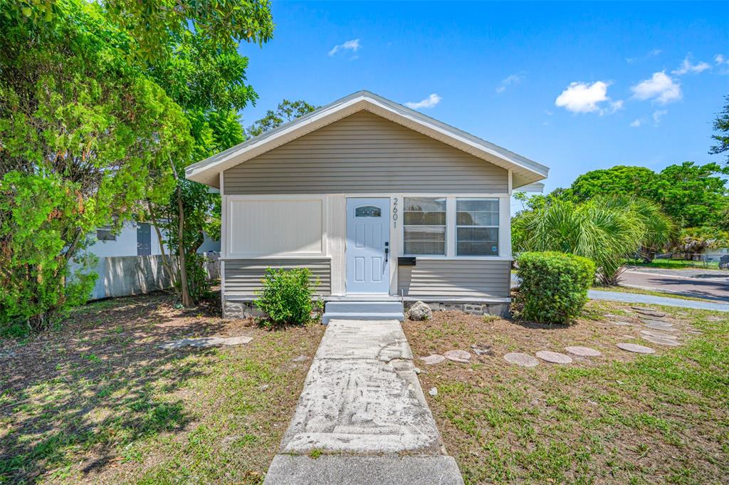 a view of a house with a yard