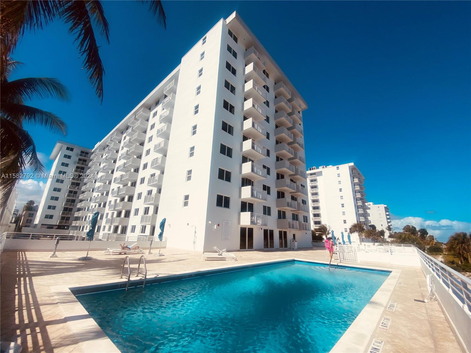 a view of swimming pool with building exterior