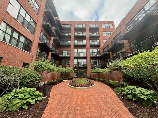 a view of a building with a yard