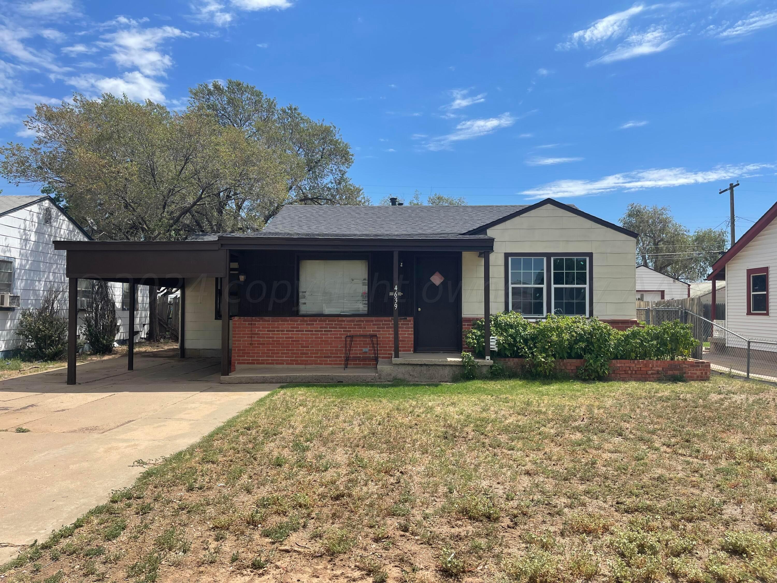 a front view of a house with a yard and porch