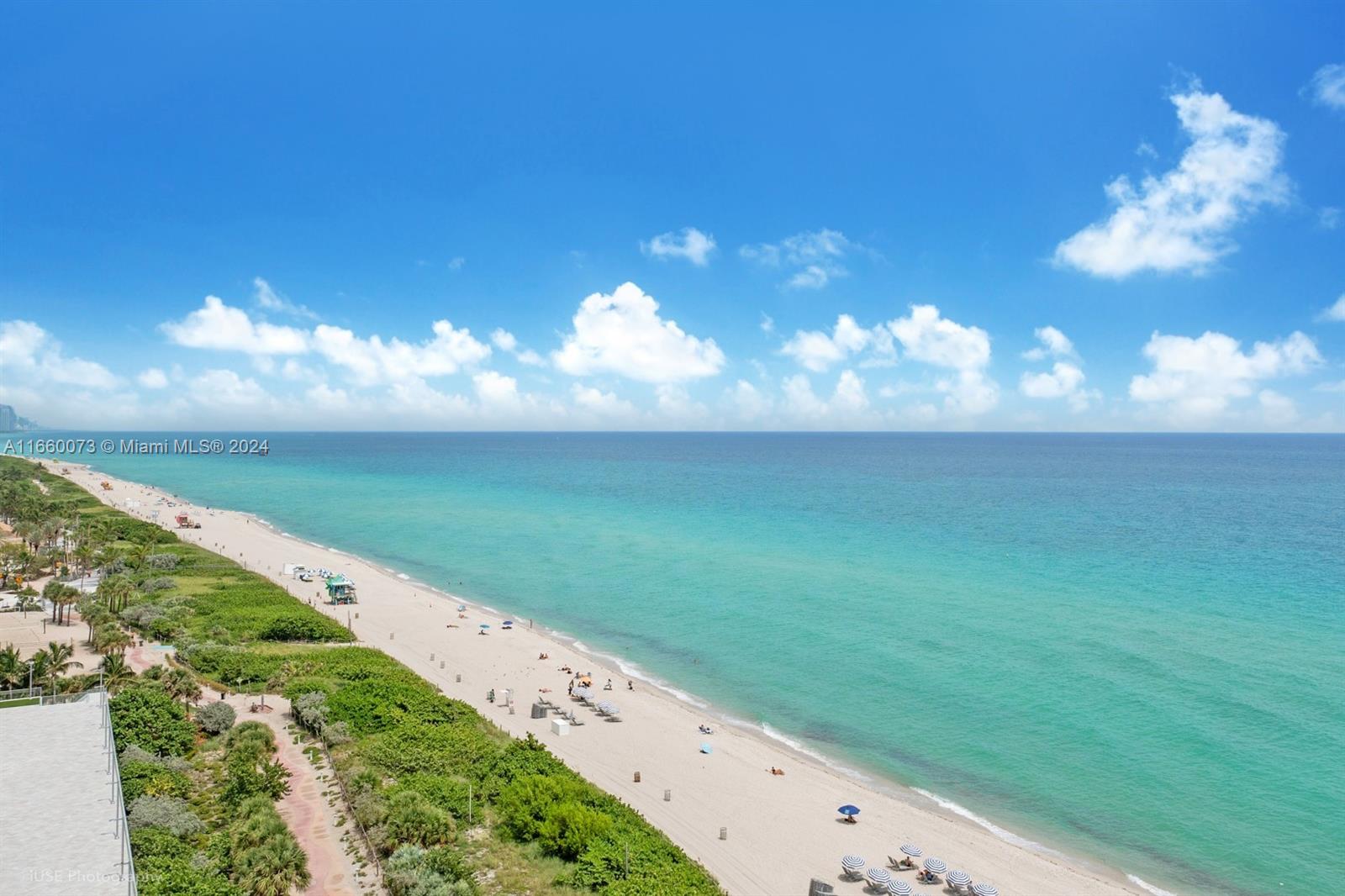 a view of an ocean and a yard