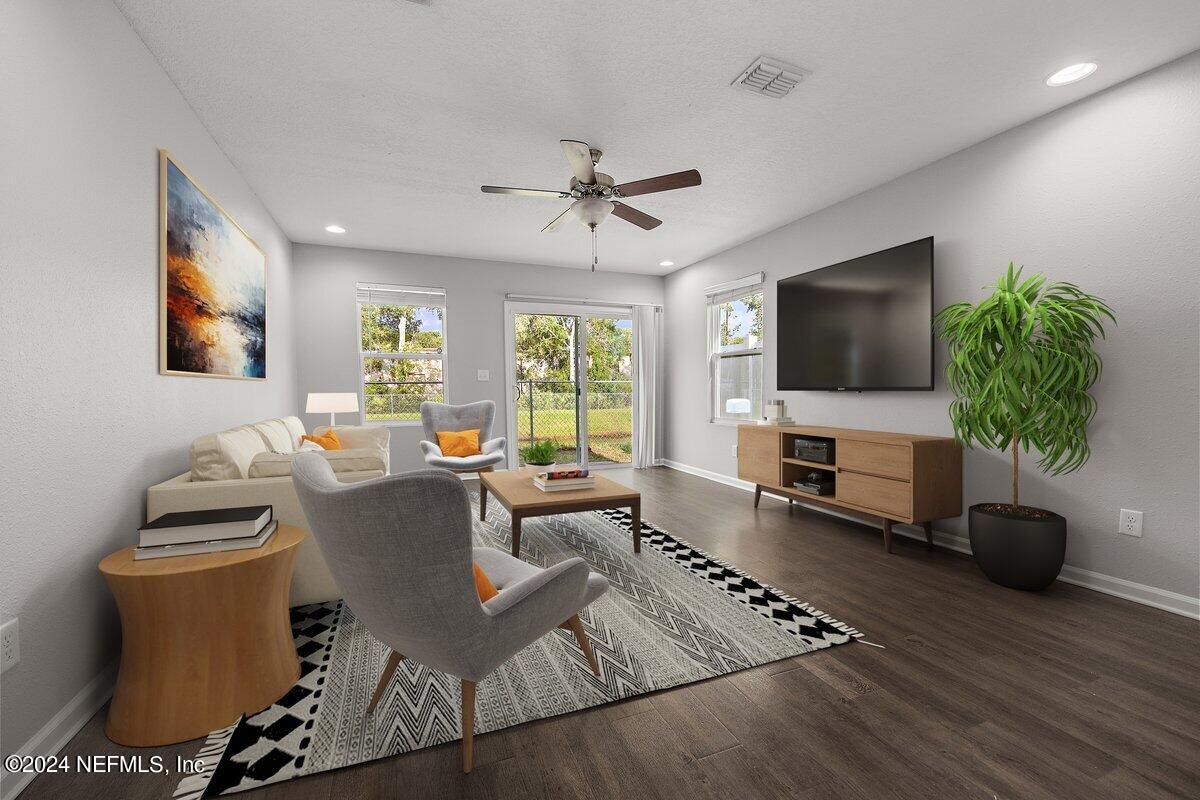 a living room with furniture and a flat screen tv