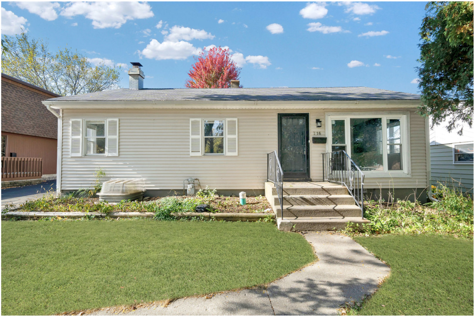 a front view of a house with garden