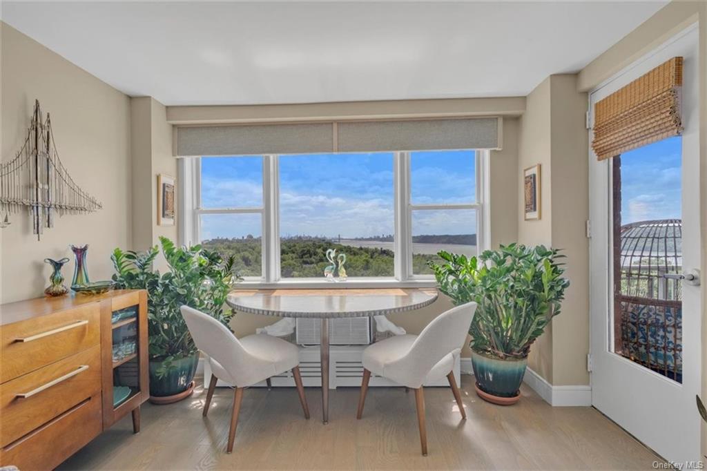 a dining room with furniture and window