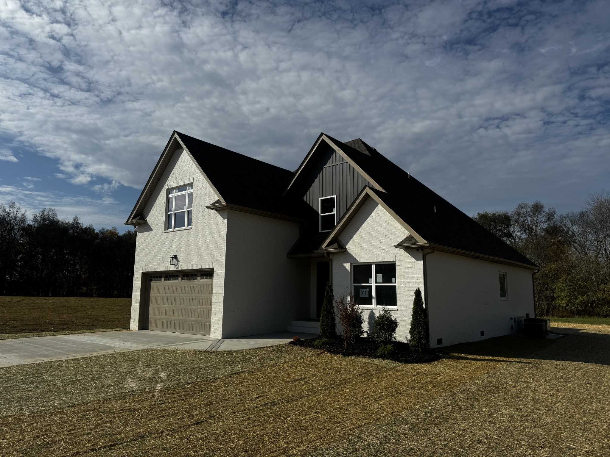 a front view of a house with a yard