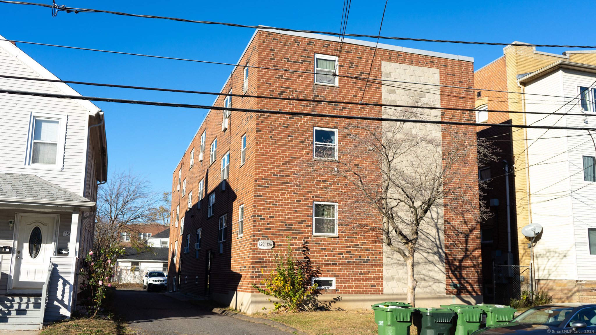 a view of a street with a building in the background