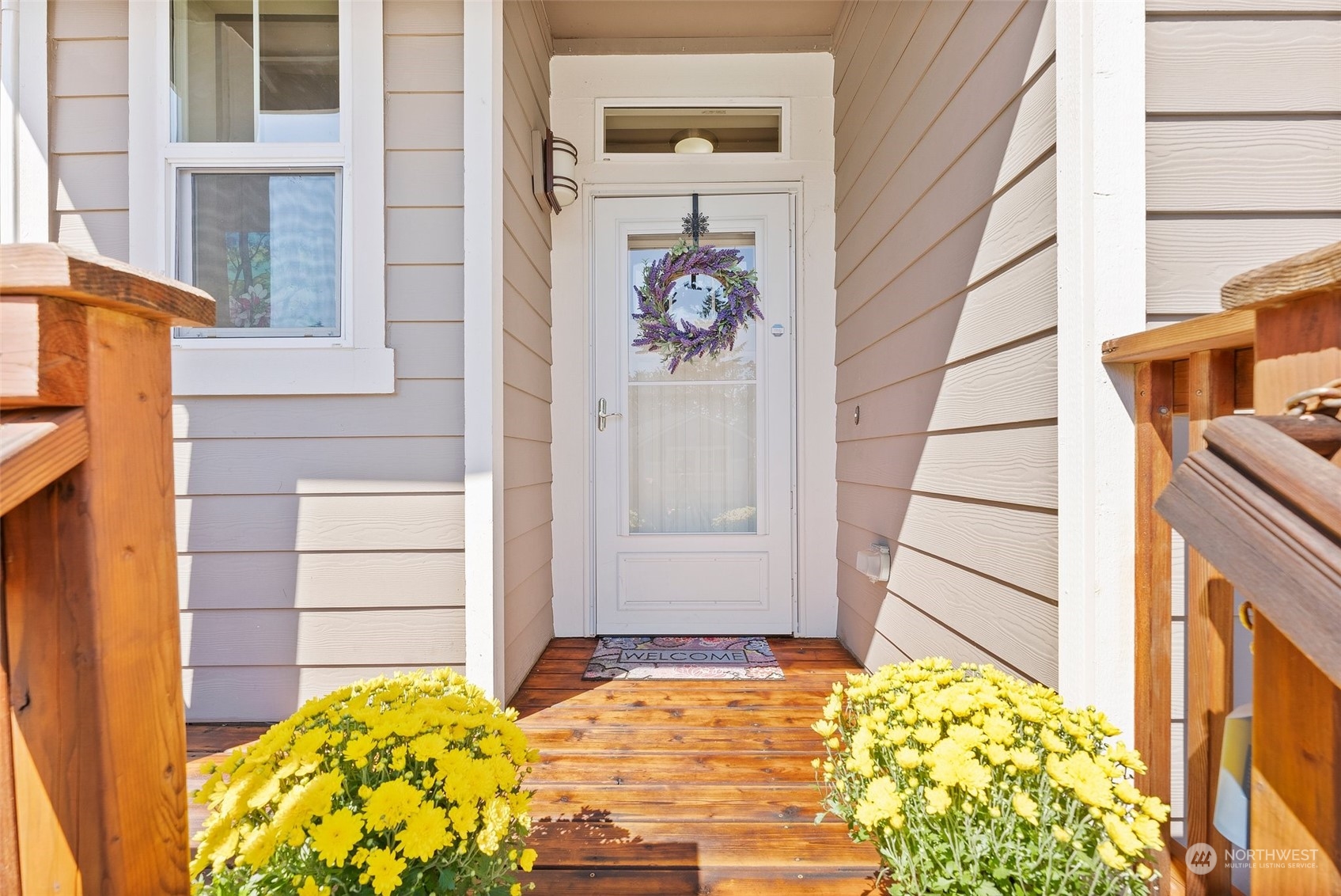 a view of front door of house with potted plant