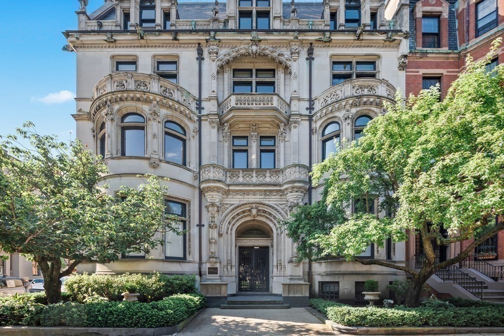 front view of a building with a garden