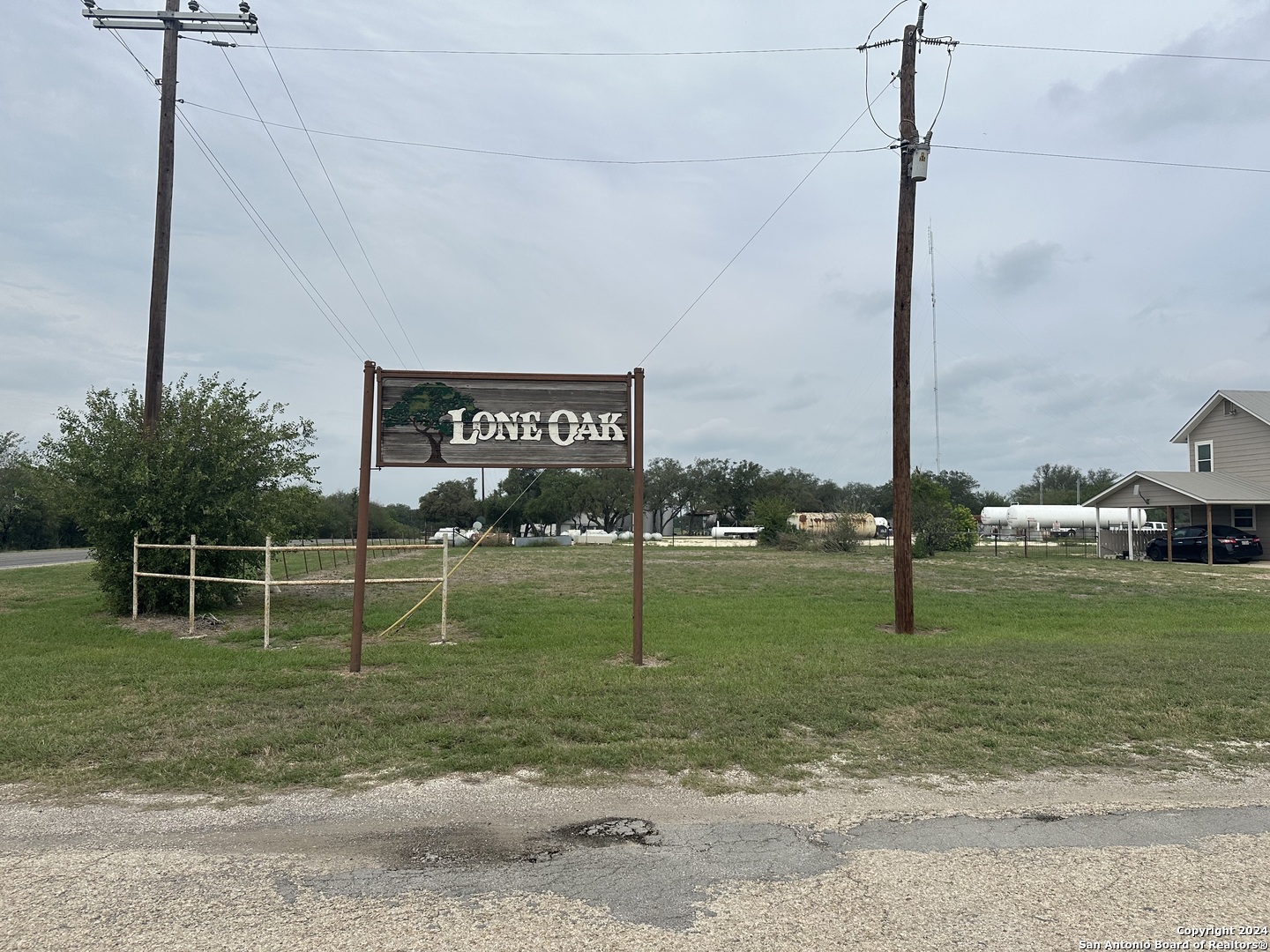 a sign board with a play ground