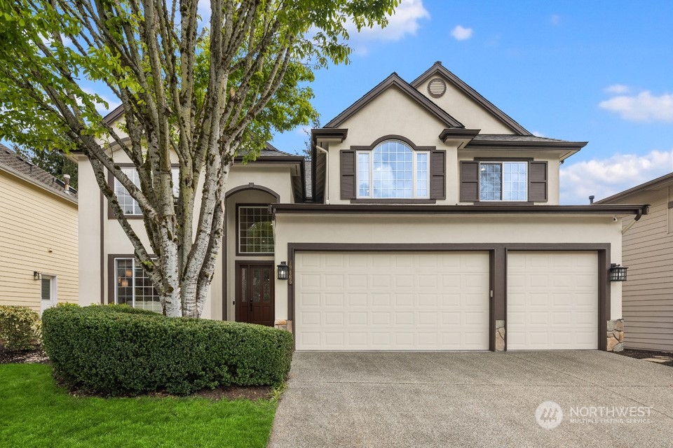 a front view of a house with a garage