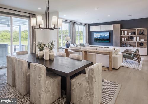 a kitchen with a table chairs refrigerator and microwave