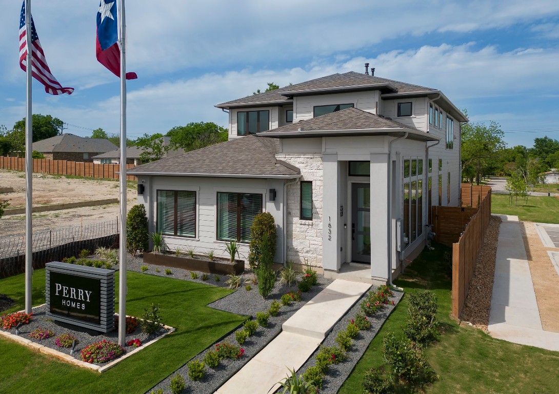 a front view of a house with garden