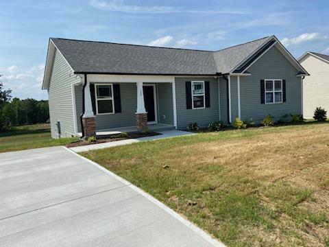 a front view of a house with yard