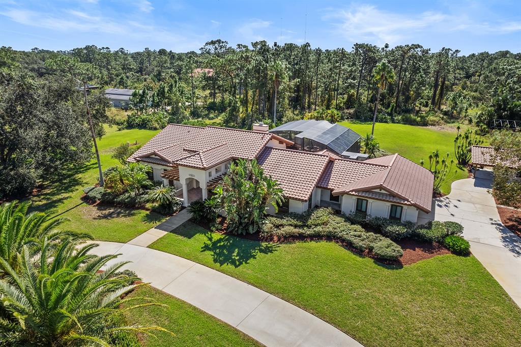 an aerial view of a house with a garden