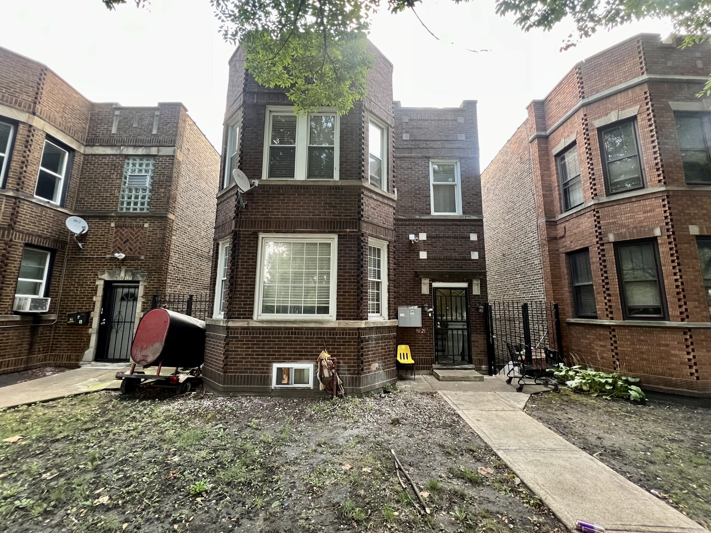 a view of a brick building with many windows