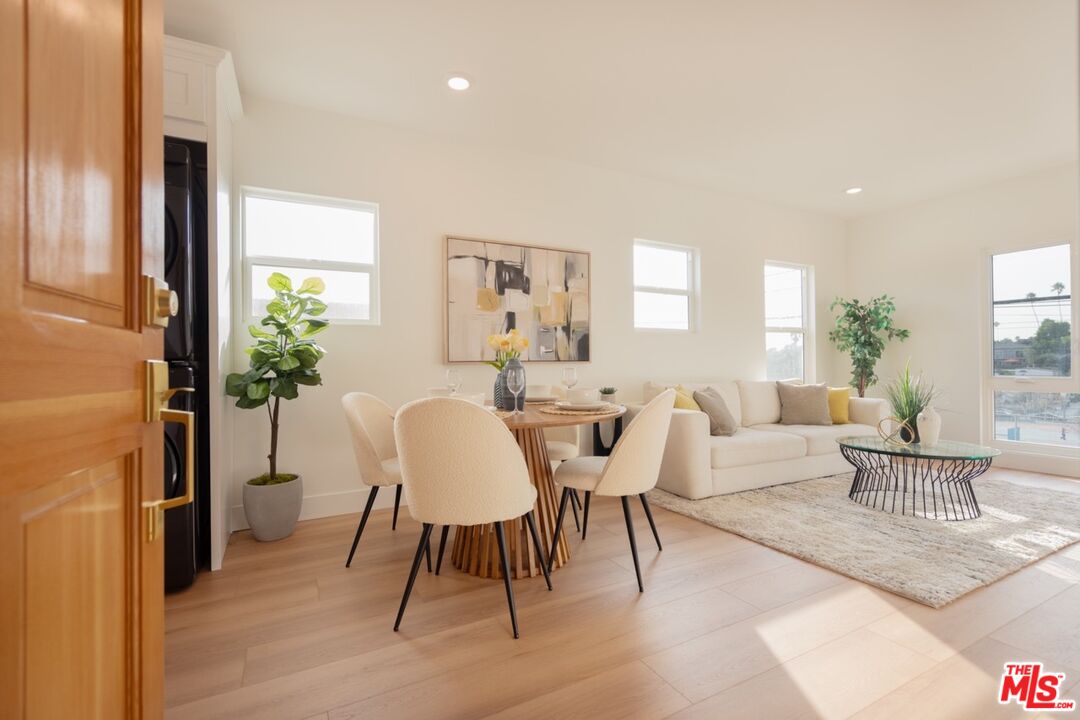 a view of a dining room with furniture window and outside view