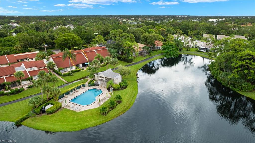 an aerial view of a house with a swimming pool