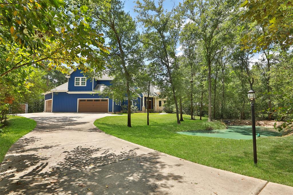 Stunning home nestled amongst the beautiful wooded lot.