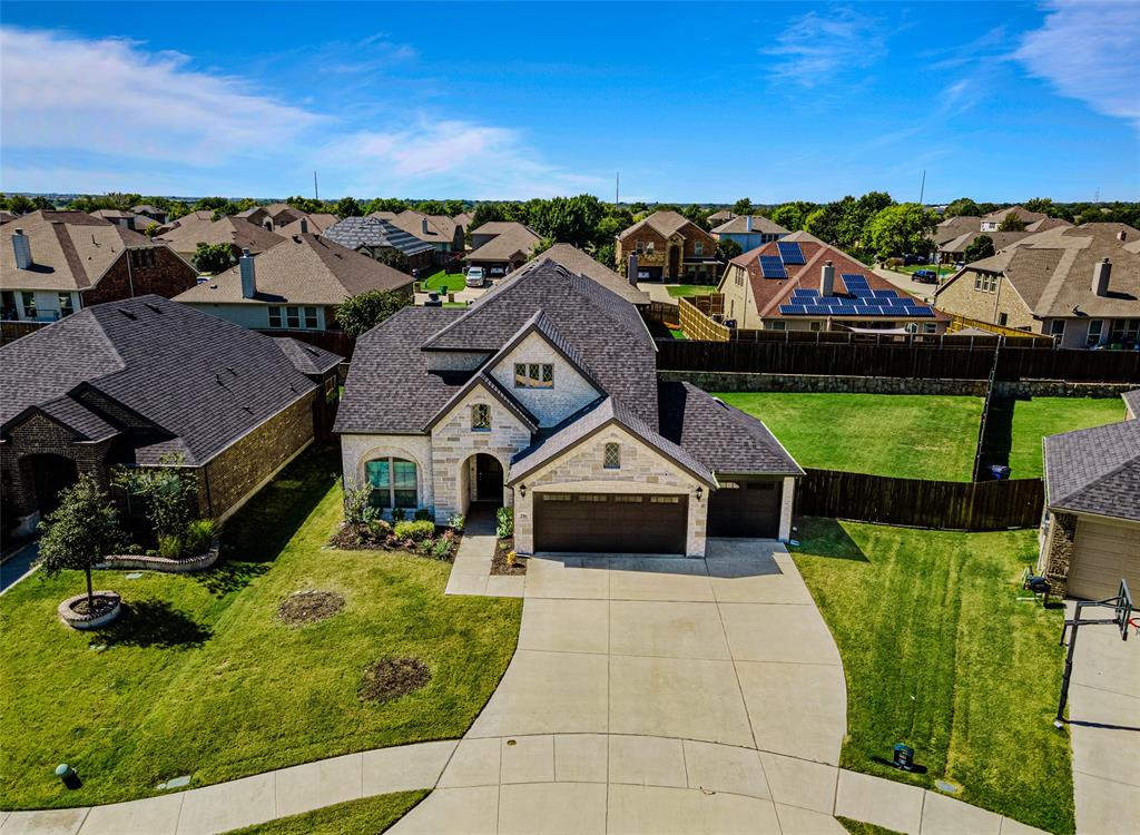 an aerial view of a house with a garden