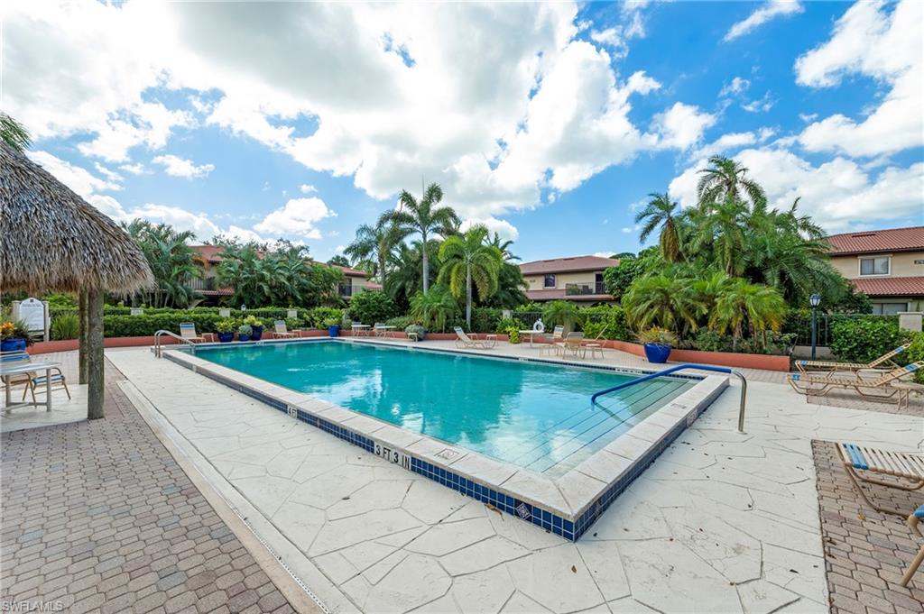 a view of a swimming pool with a yard