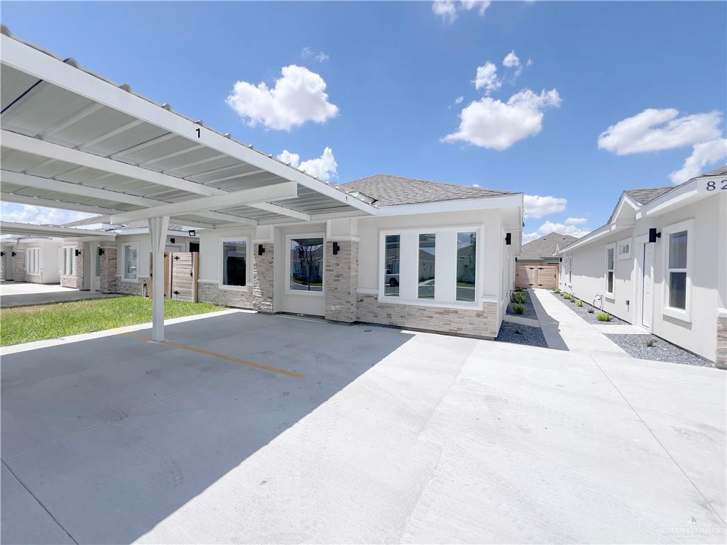 a view of a house with a backyard