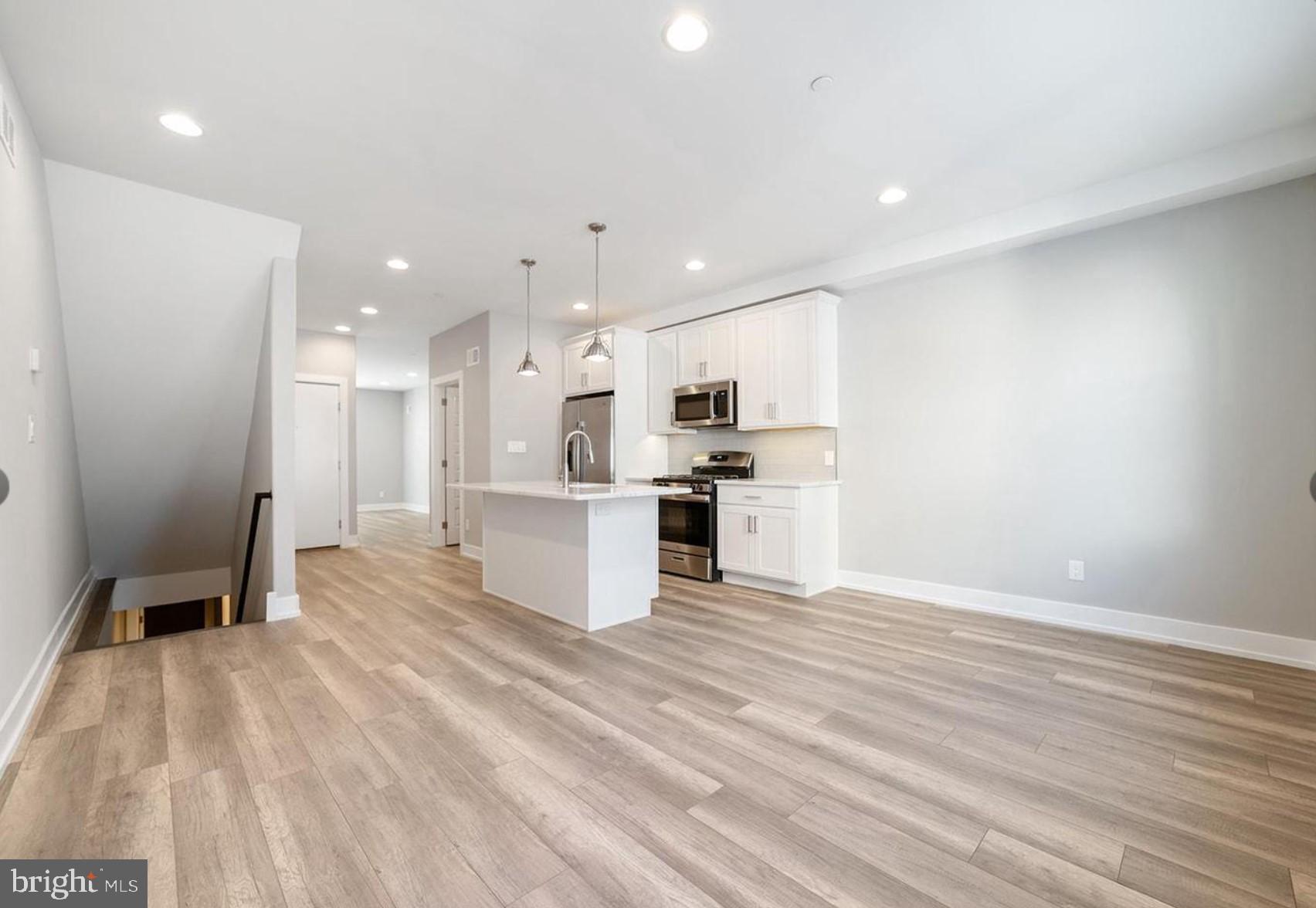 a view of kitchen with wooden floor