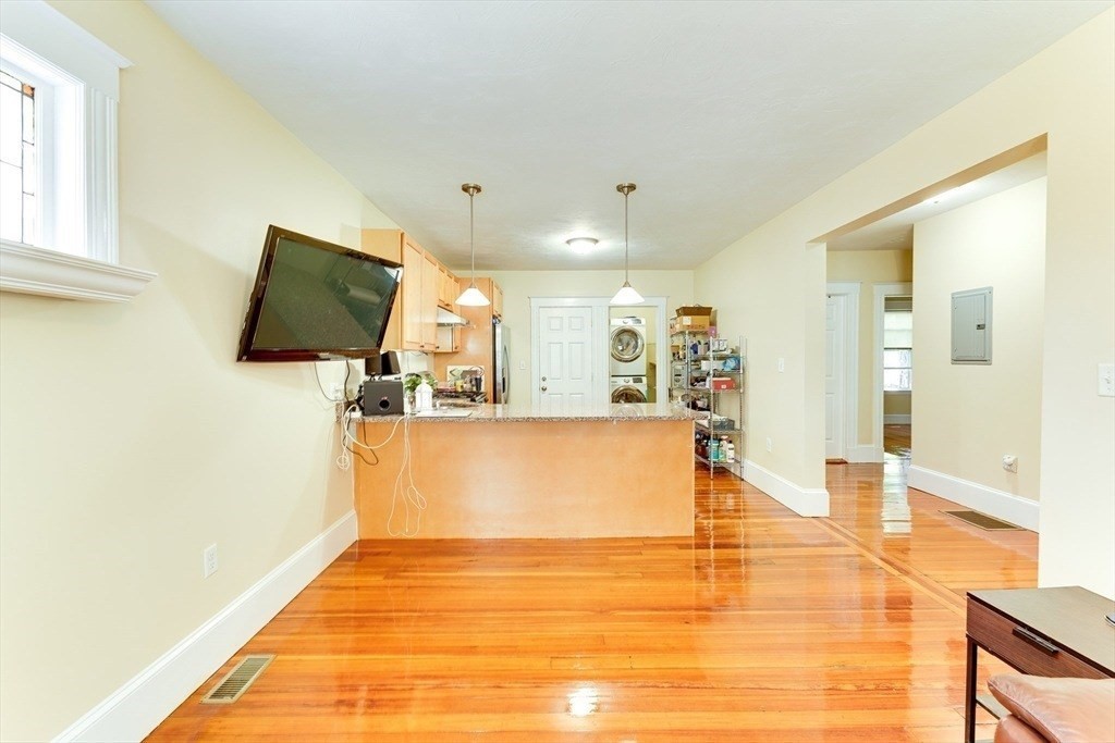 a view of a living room with a flat screen tv