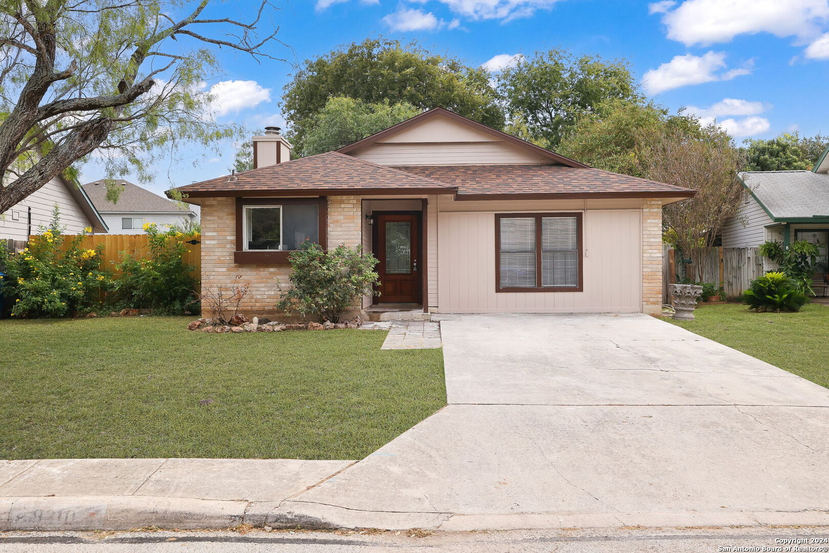 a front view of a house with a yard