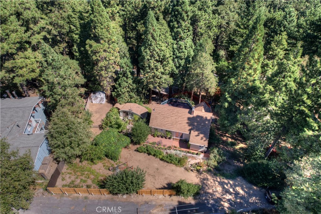 an aerial view of a house with a yard